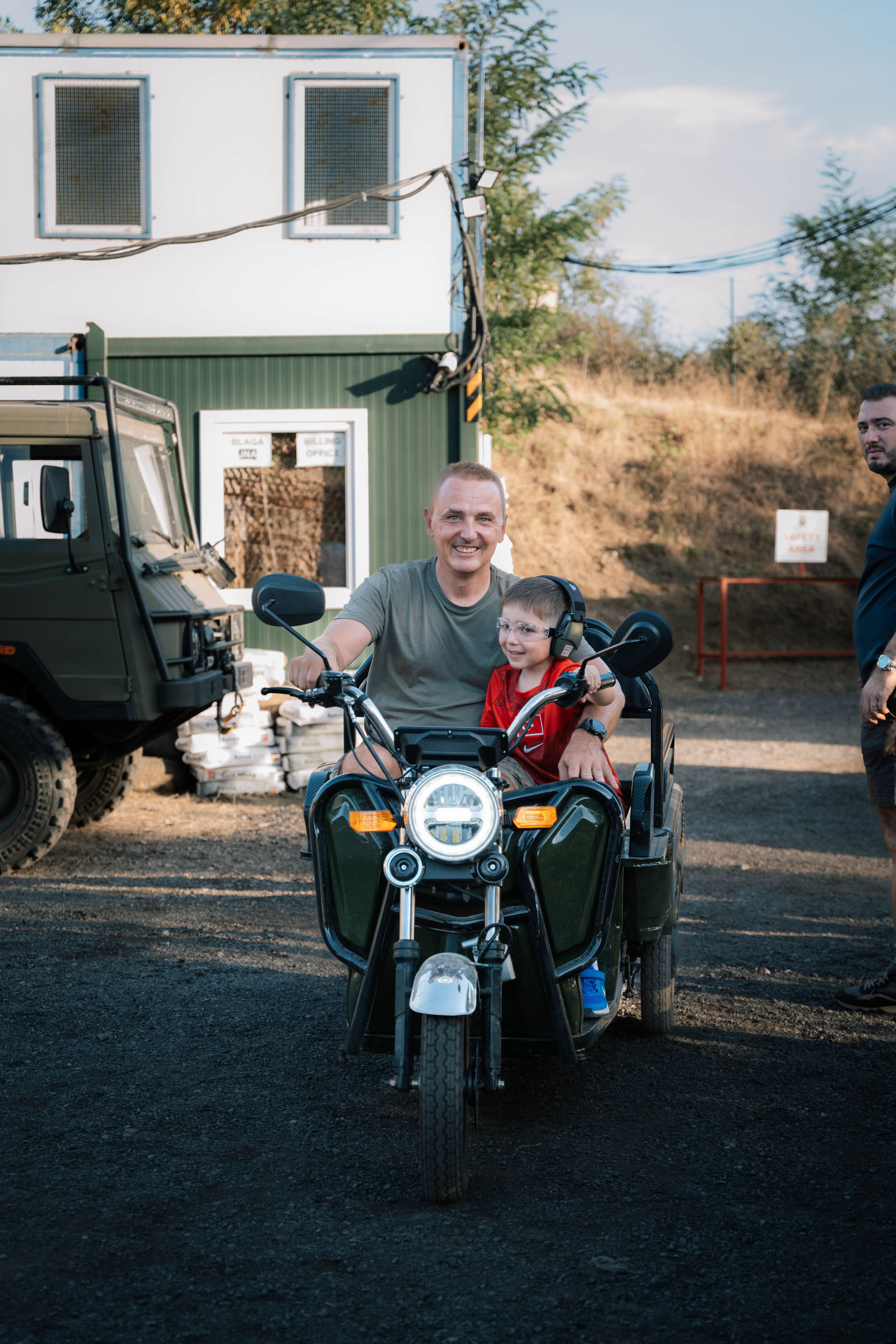 A father and son on a sidecar bike