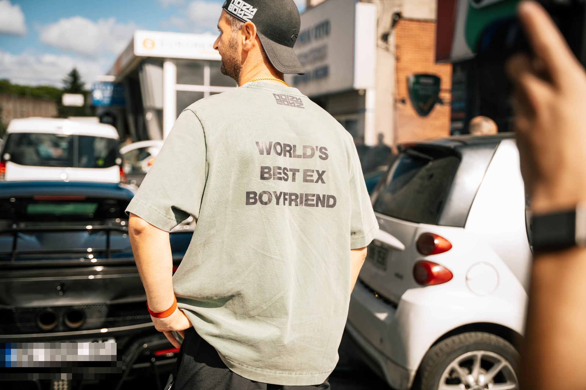 Green Noizy Boyz shirt reading World's best ex boyfriend