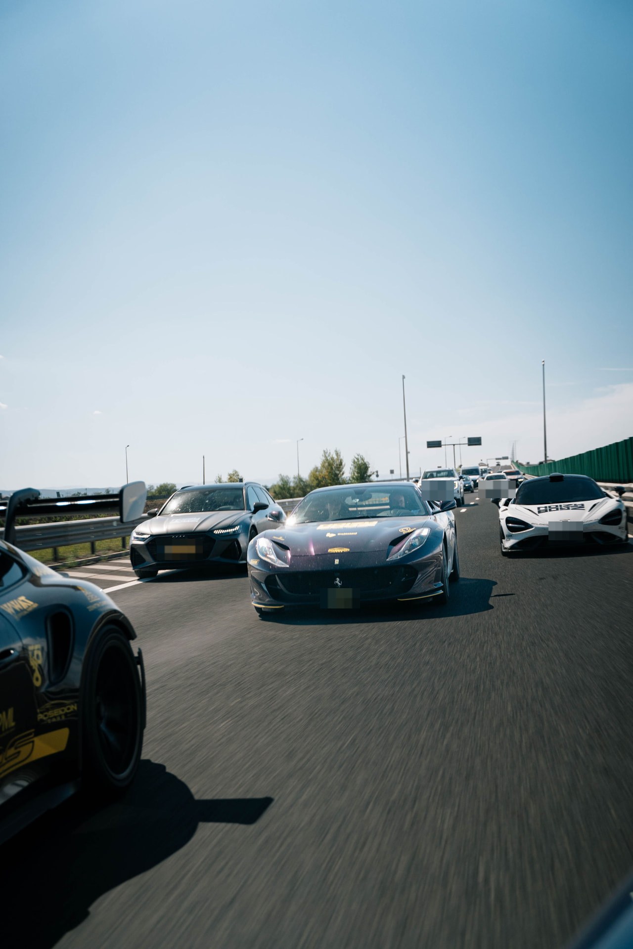 Ferrari, Audi and McLaren on the highway