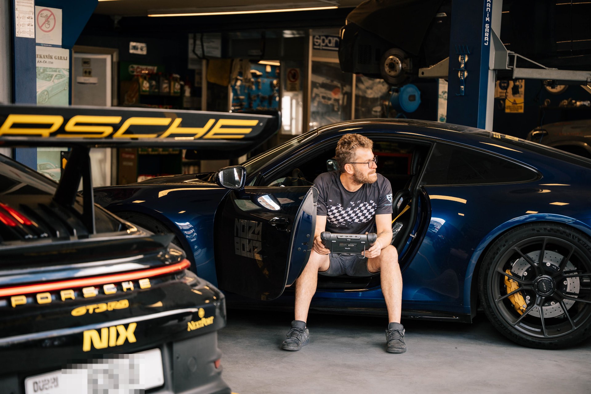 A mechanic checking the GT3 in the workshop