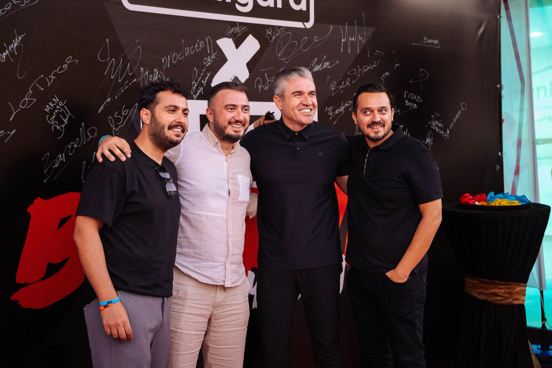Partners together at the signature wall